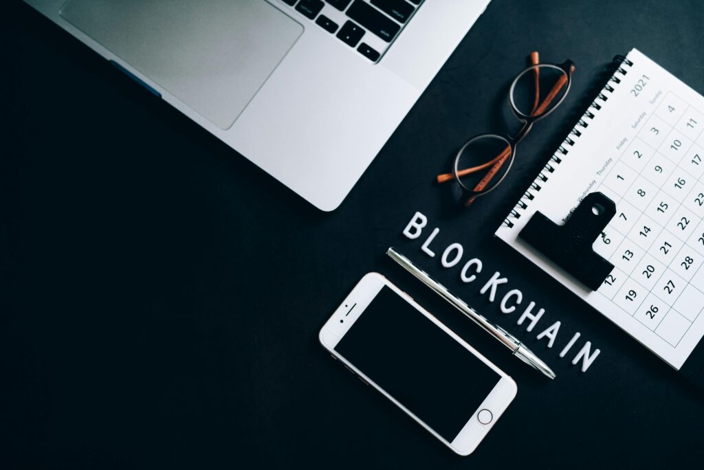pexels-photo-7887847-7887847 Top view of a modern digital workspace with blockchain theme essentials.