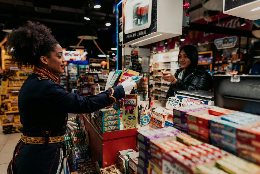 A lively exchange at a Buenos Aires supermarket with colorful products in view.